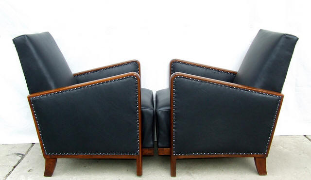 Black leather armchairs.